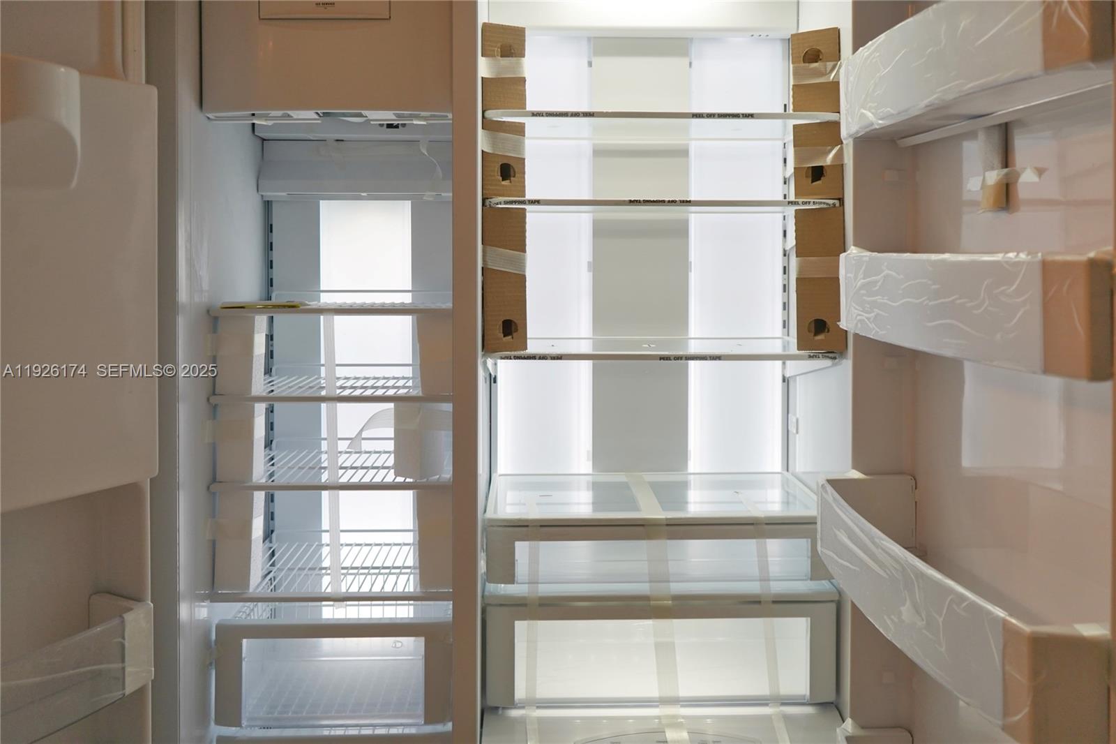 848 Brickell Key Drive, Unit 306 Miami, FL 33131 - Photo 51 of 66 a view of walk in closet with empty racks