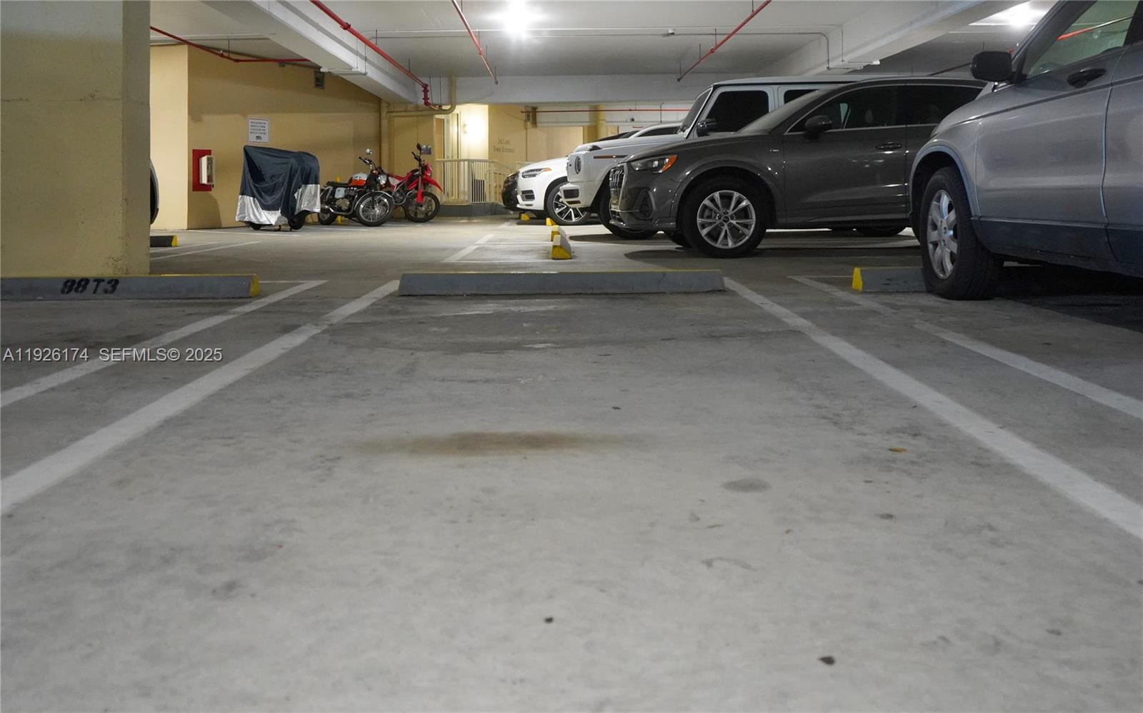 848 Brickell Key Drive, Unit 306 Miami, FL 33131 - Photo 58 of 66 a view of parking garage with cars parked
