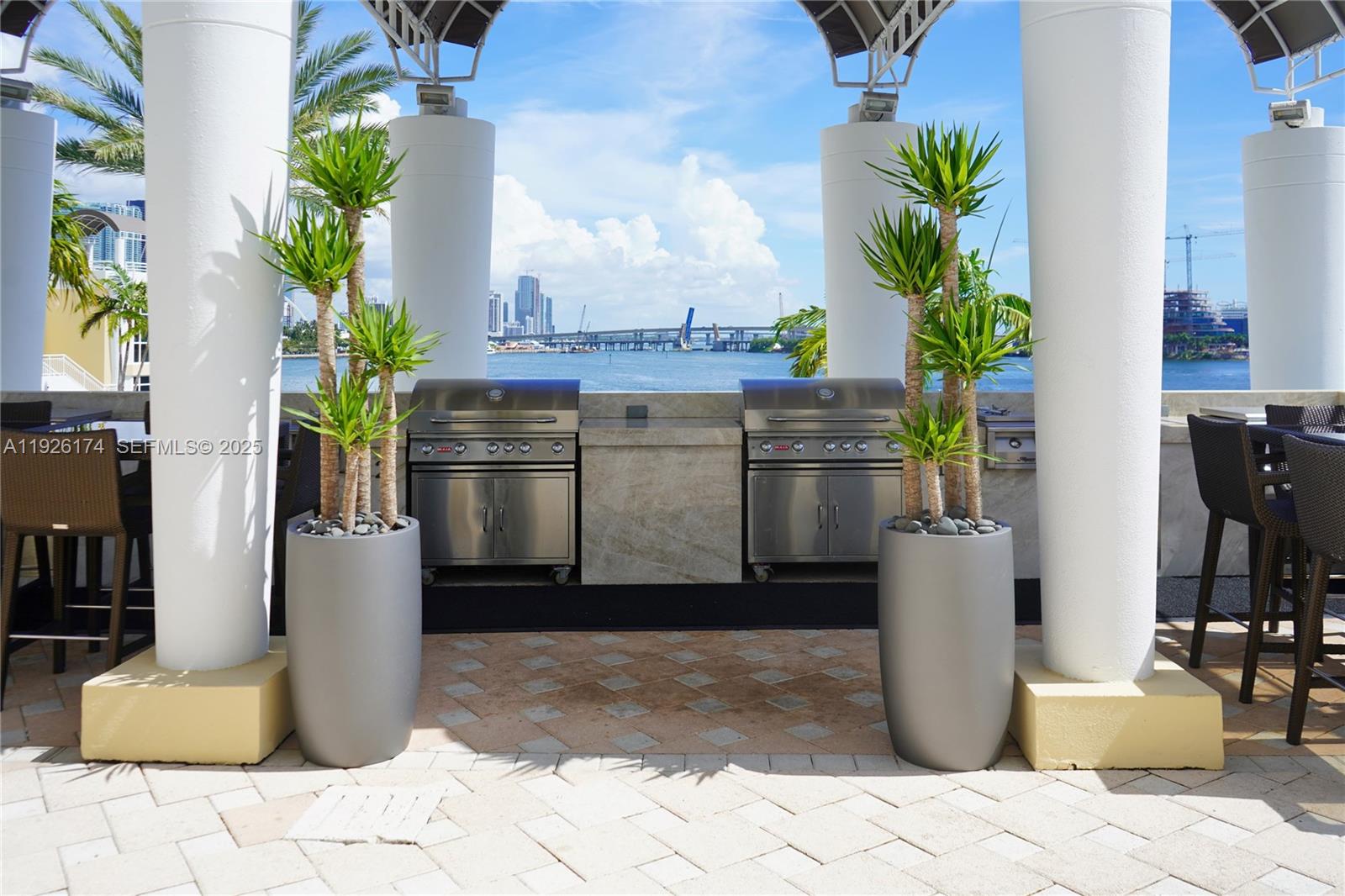848 Brickell Key Drive, Unit 306 Miami, FL 33131 - Photo 60 of 66 a view of a living room with a potted plant