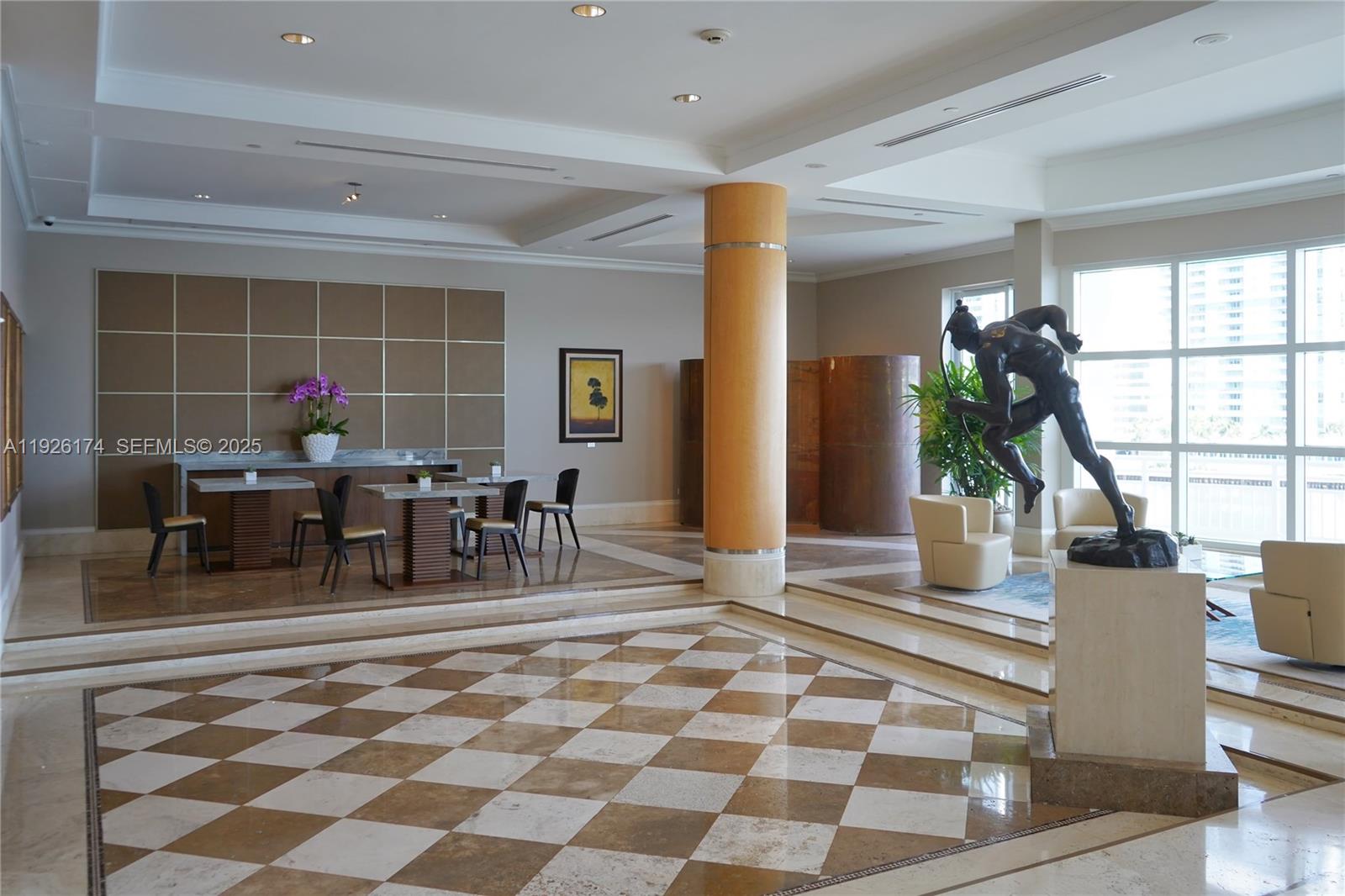 848 Brickell Key Drive, Unit 306 Miami, FL 33131 - Photo 64 of 66 a dining room with furniture and a floor to ceiling window