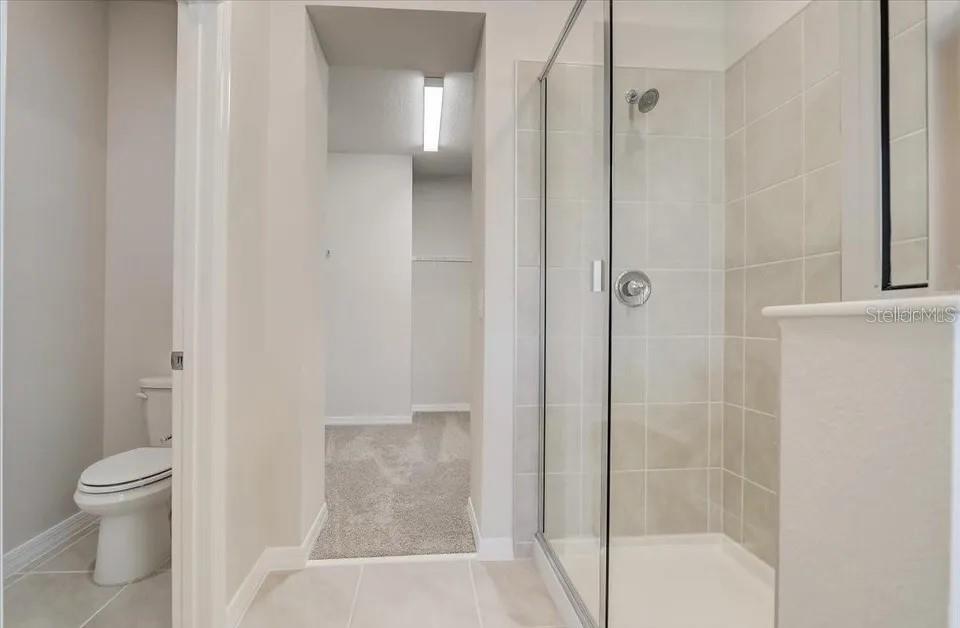 1851 Terrapin Road Ocoee, FL 34761 - Photo 14 of 22 a bathroom with a shower and a toilet