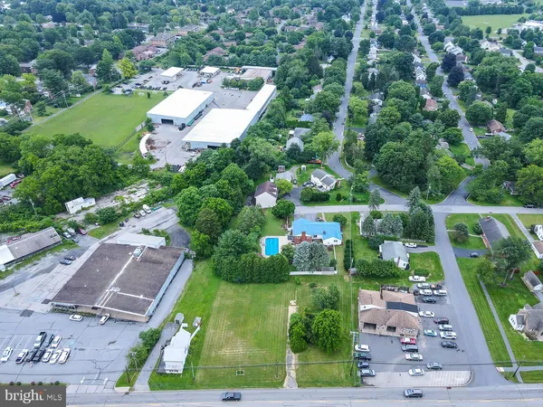 an aerial view of a house with a garden