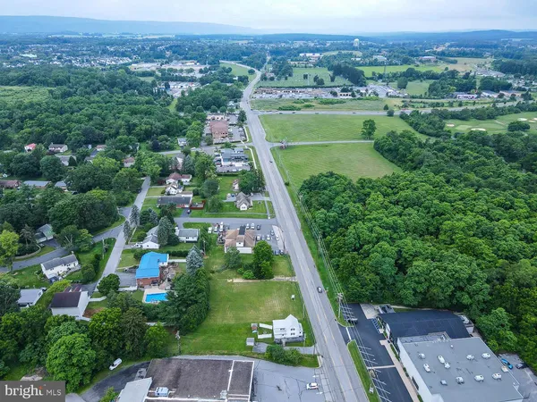 a view of a field with an ocean