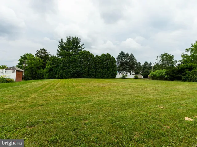 a view of a swimming pool and an outdoor space