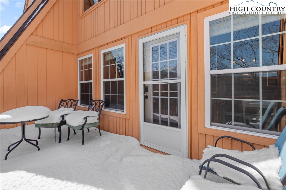 220 Charter Hills Road, Unit C2 Beech Mountain, NC 28604 - Photo 21 of 26 a backyard of a house with seating space