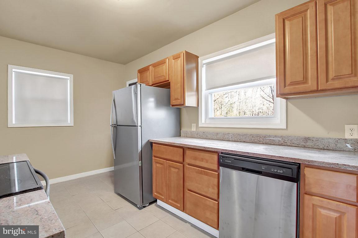 333 Back River Neck Road Baltimore, MD 21221 - Photo 1 of 25 a kitchen with stainless steel appliances granite countertop a refrigerator and a sink