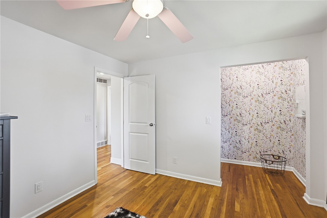 150 Littlejohn Road Troy, OH 45373 - Photo 27 of 40 This bright room features warm hardwood floors, providing a comfortable and inviting atmosphere.