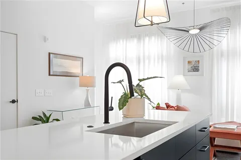 a kitchen with a table and a sink