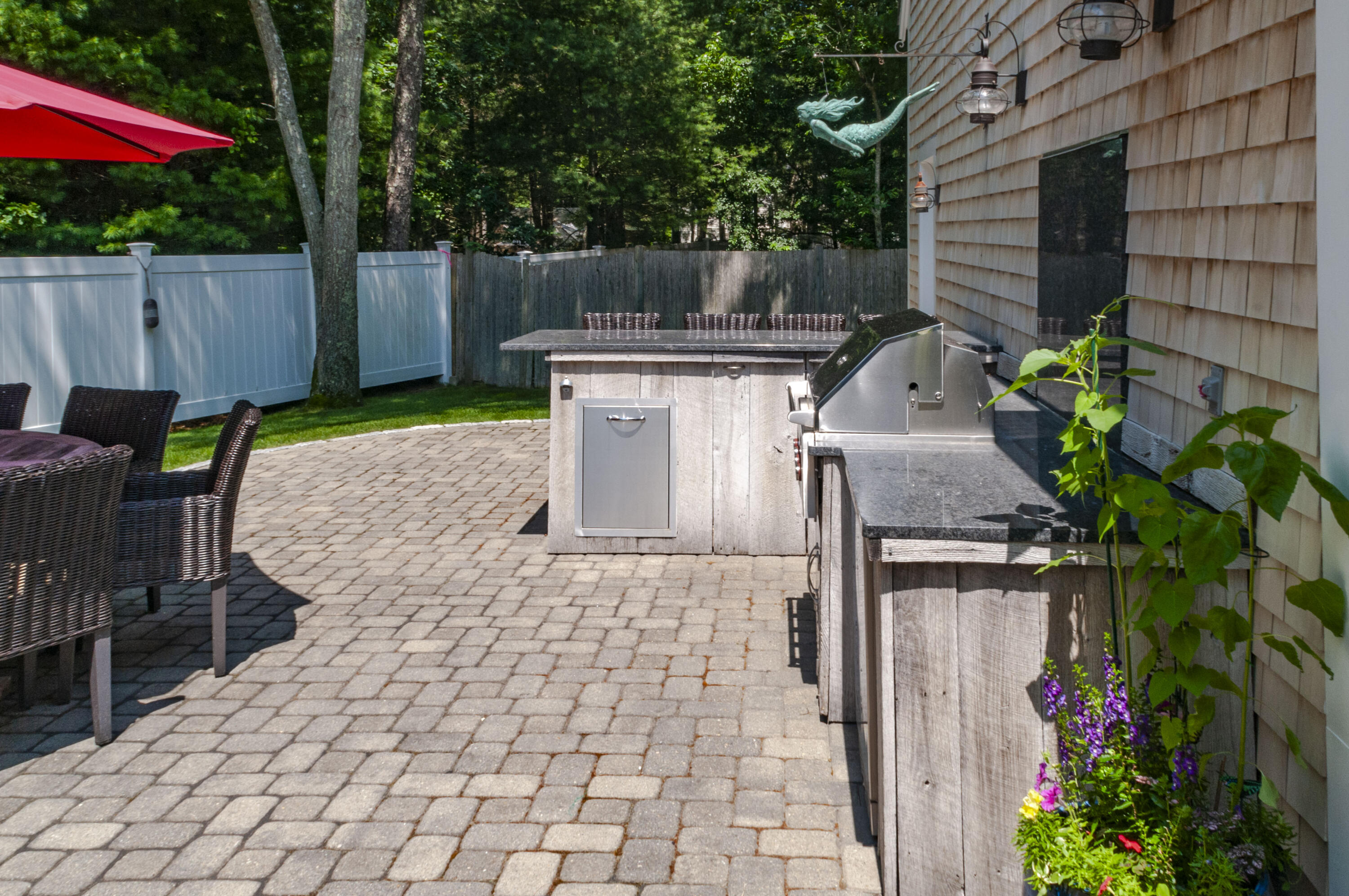 1774 South County Road Osterville, MA 02655 - Photo 13 of 75 a view of a backyard with sitting area