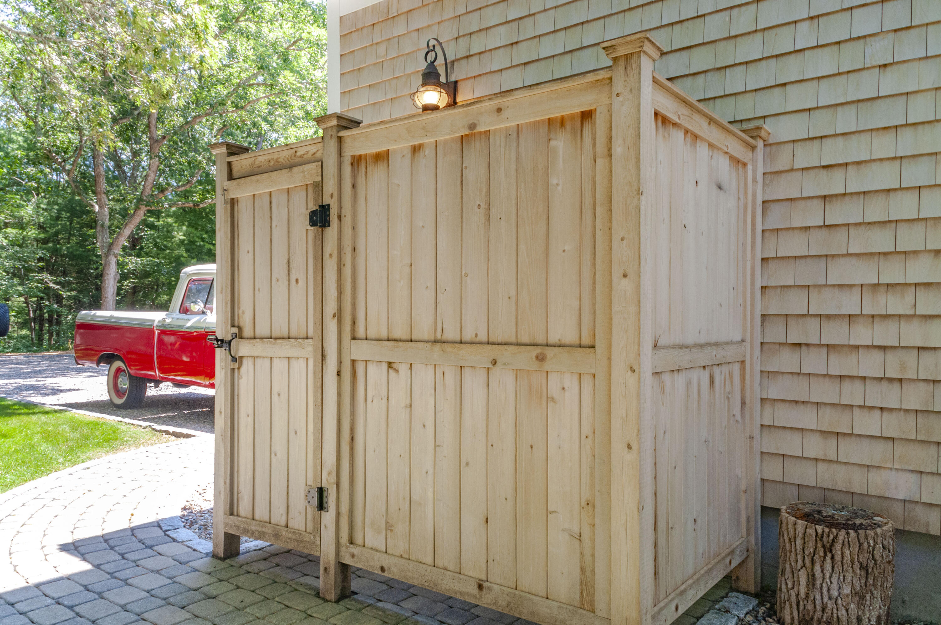 1774 South County Road Osterville, MA 02655 - Photo 16 of 75 a view of a house with a backyard and chair
