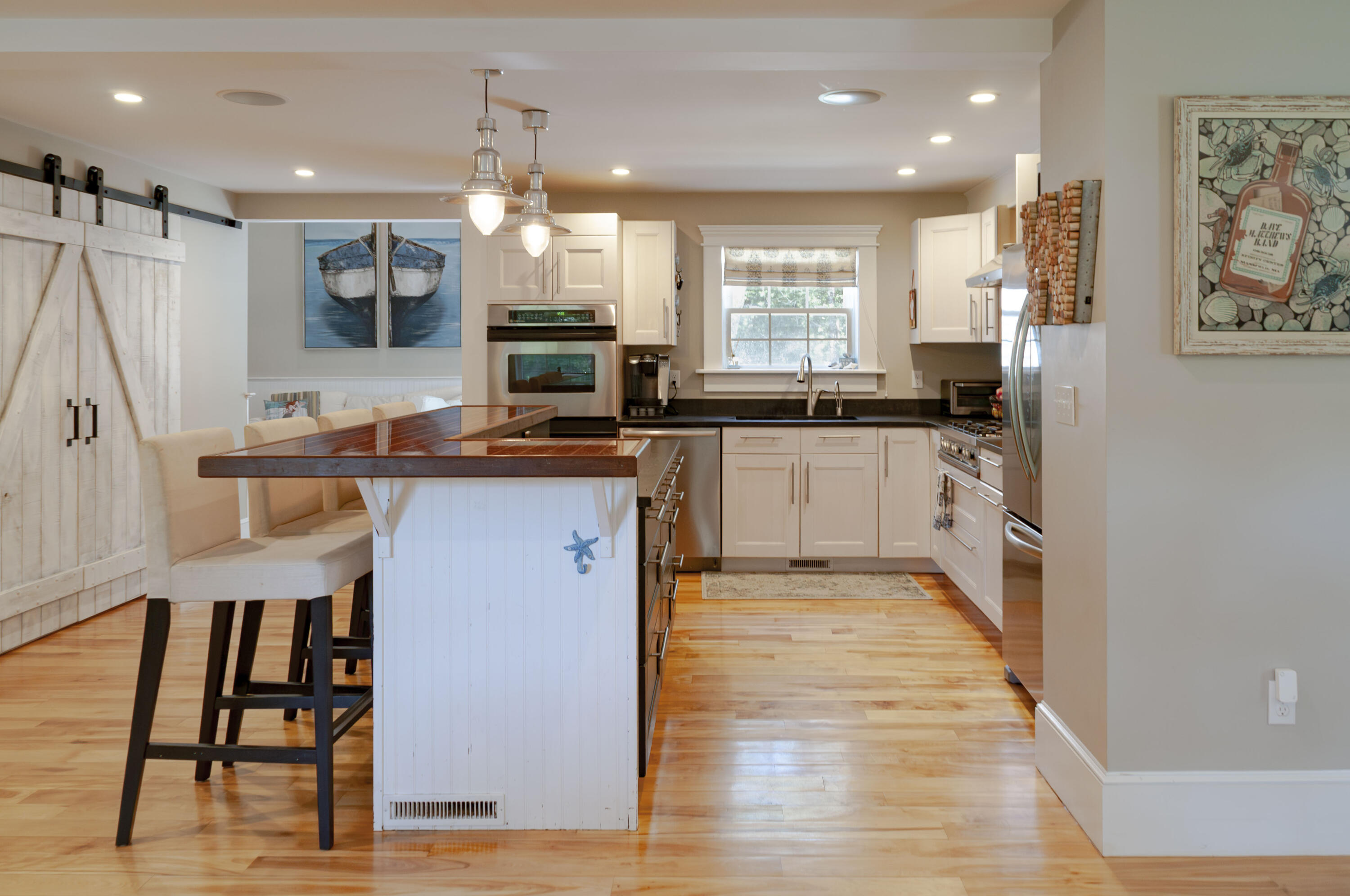 1774 South County Road Osterville, MA 02655 - Photo 28 of 75 a kitchen with stainless steel appliances granite countertop a stove top oven a sink and a refrigerator