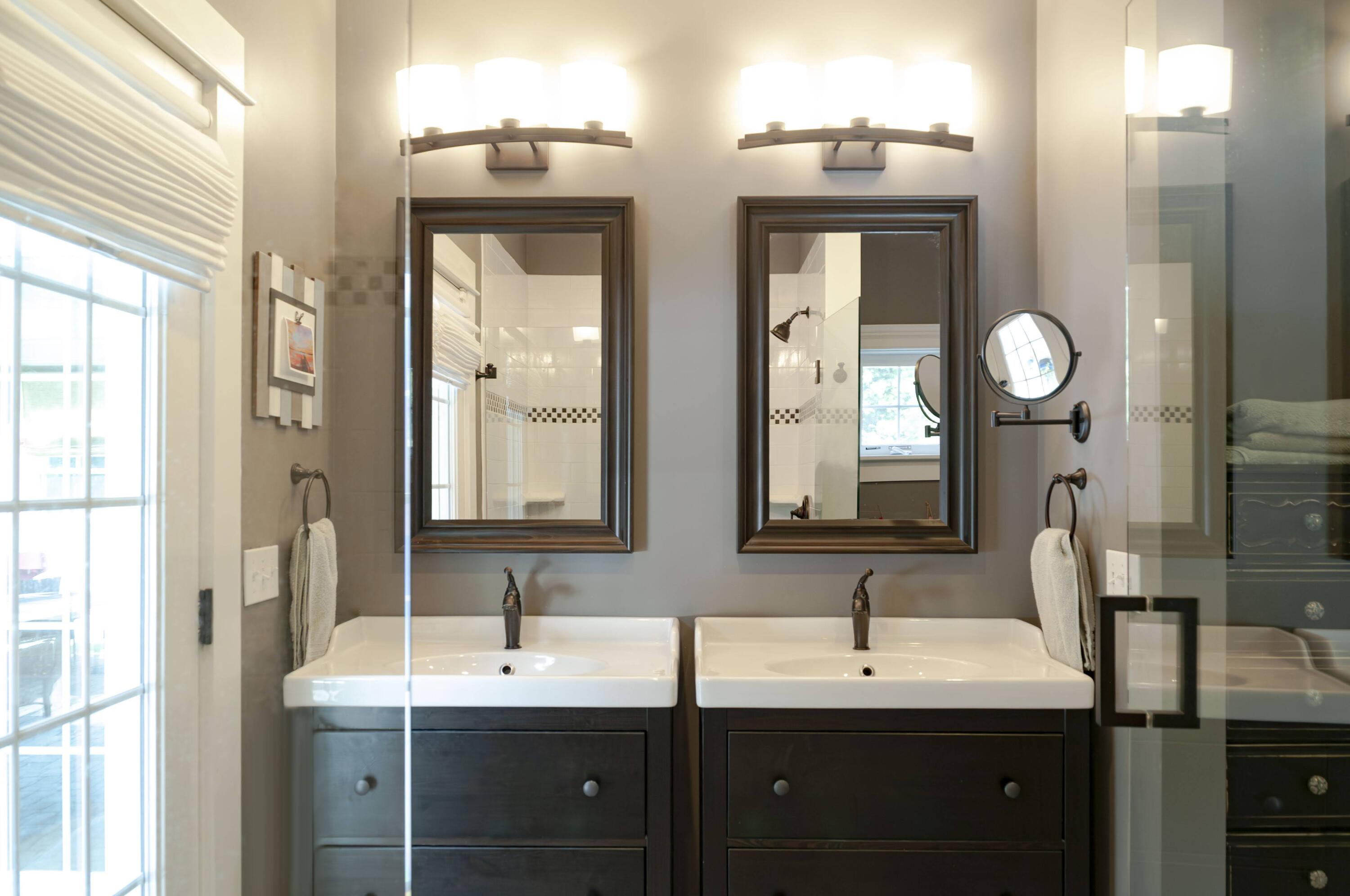 1774 South County Road Osterville, MA 02655 - Photo 47 of 75 a bathroom with 2 sink and a mirror