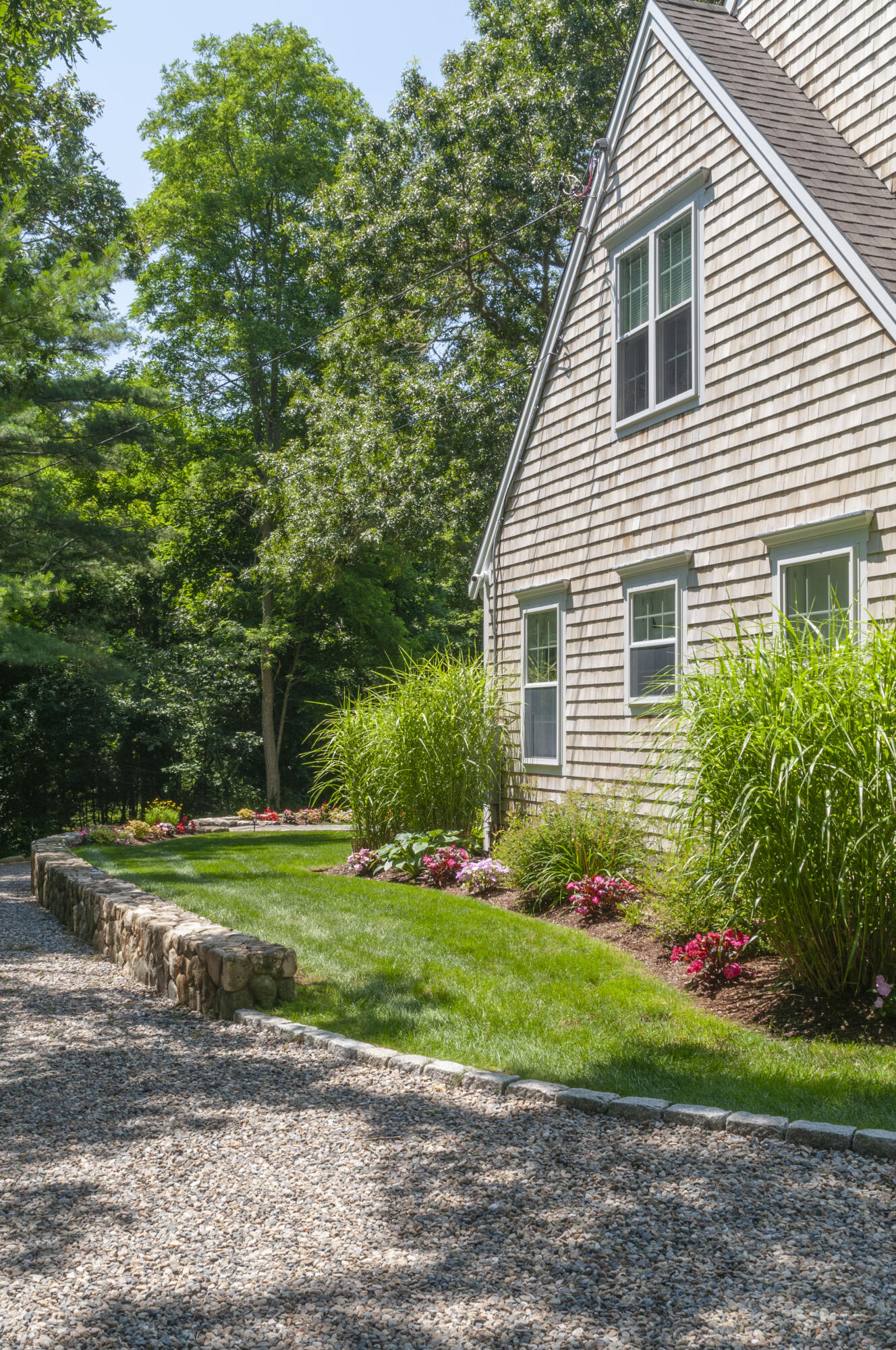 1774 South County Road Osterville, MA 02655 - Photo 6 of 75 a house that has a lot of flowers in it