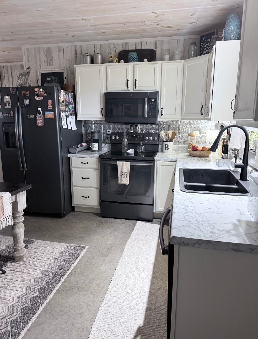 99 Busby Road Loretto, TN 38469 - Photo 13 of 25 a kitchen with stainless steel appliances granite countertop a sink stove and refrigerator
