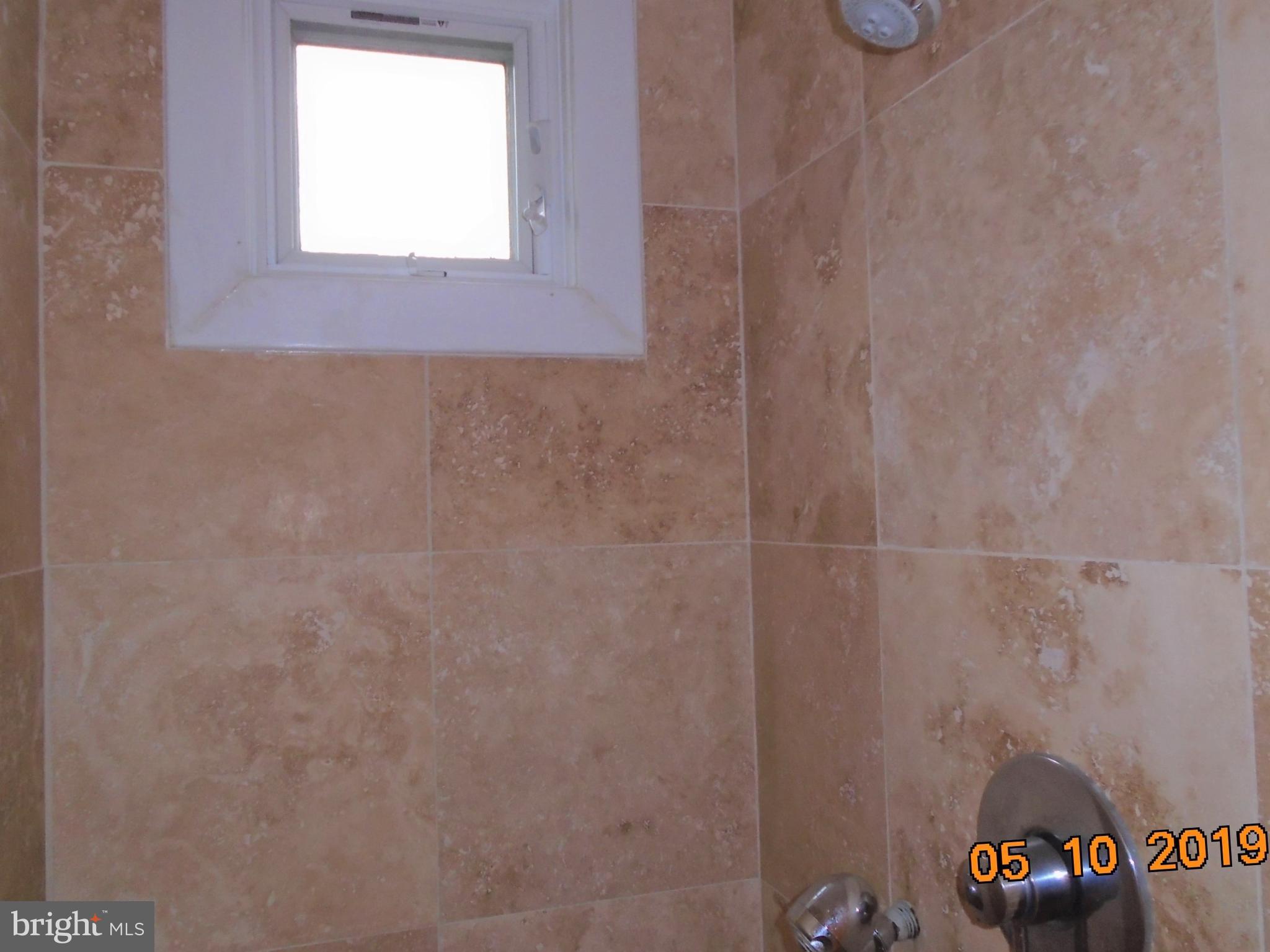 2419 Darrow Street Silver Spring, MD 20902 - Photo 18 of 33 a bathroom with a window