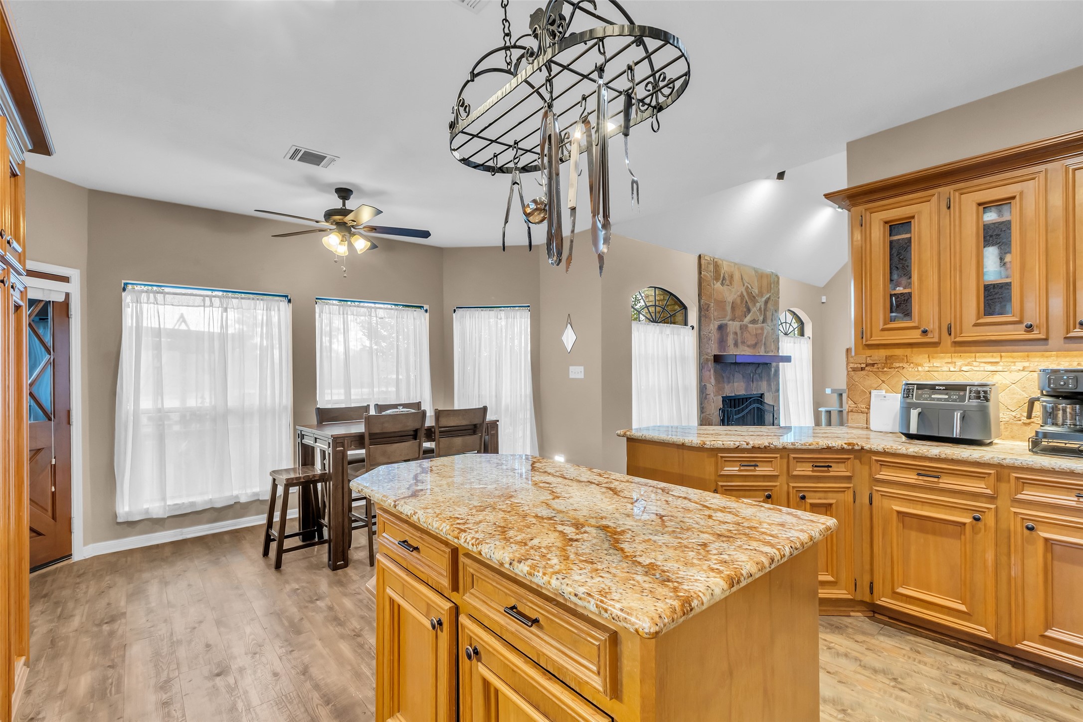 28414 Dobbin-Huffsmith Road Magnolia, TX 77354 - Photo 11 of 39 a kitchen with stainless steel appliances granite countertop a sink and a refrigerator