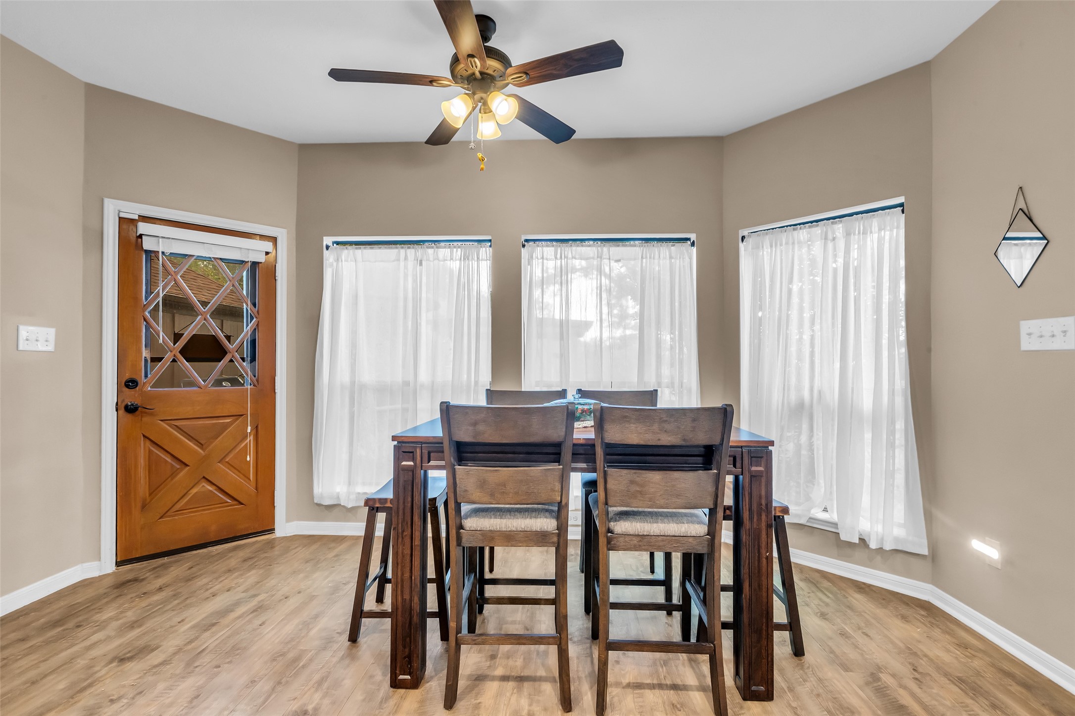 28414 Dobbin-Huffsmith Road Magnolia, TX 77354 - Photo 13 of 39 a view of a dining room with furniture window and wooden floor