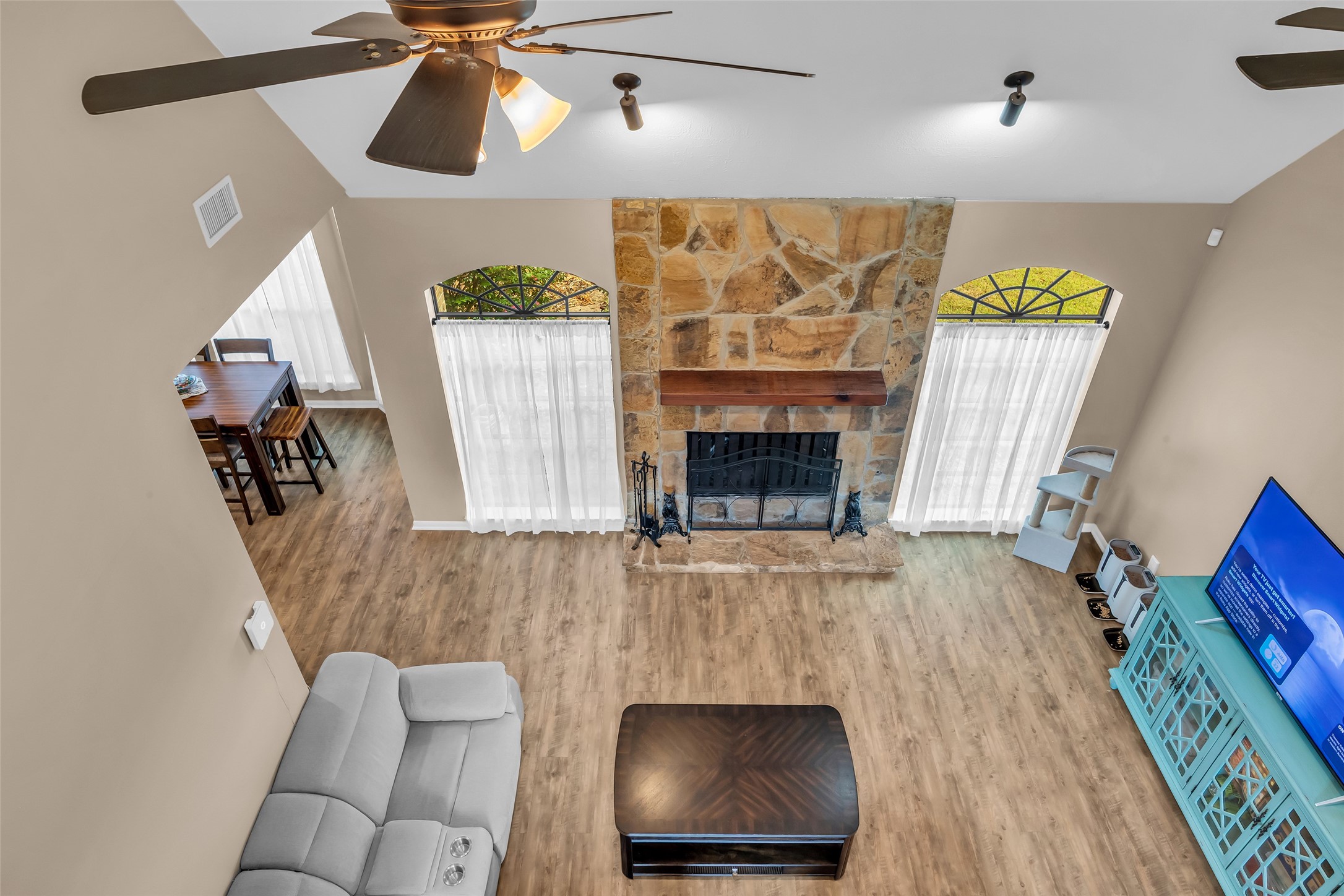 28414 Dobbin-Huffsmith Road Magnolia, TX 77354 - Photo 22 of 39 a living room with furniture and a fireplace