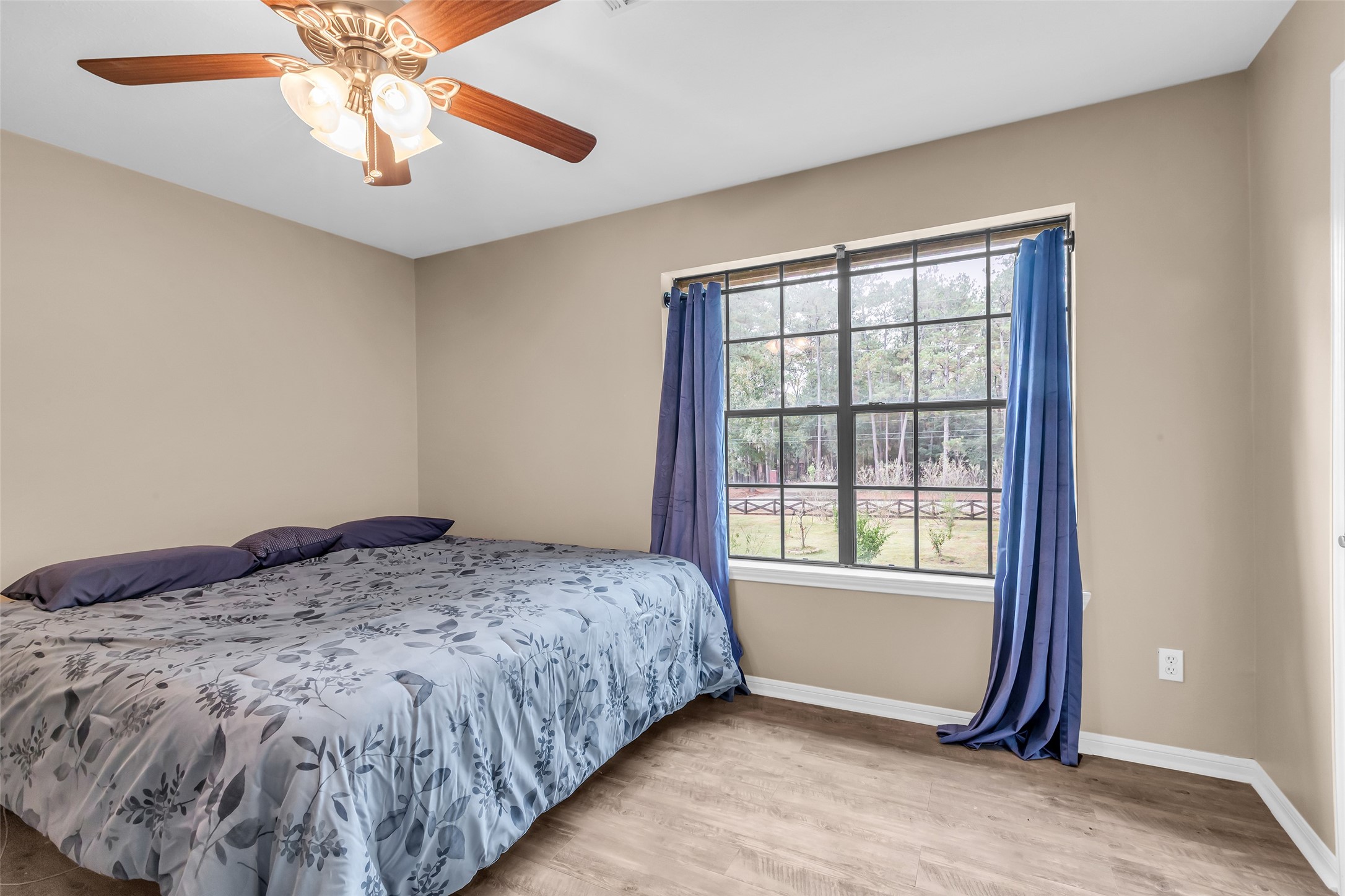 28414 Dobbin-Huffsmith Road Magnolia, TX 77354 - Photo 25 of 39 a bedroom with a bed and a window
