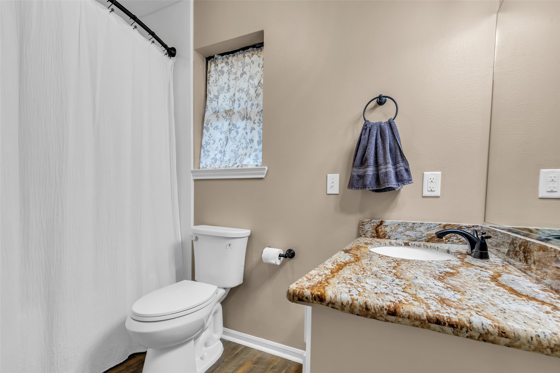 28414 Dobbin-Huffsmith Road Magnolia, TX 77354 - Photo 26 of 39 a bathroom with a granite countertop sink and a toilet