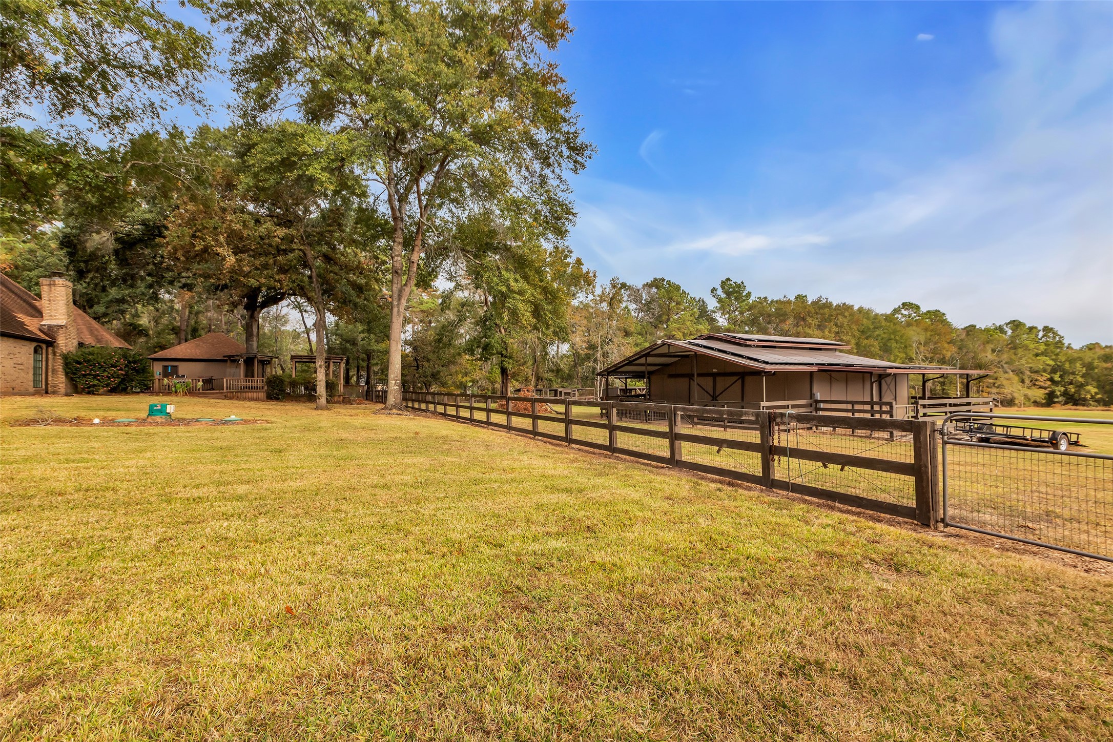 28414 Dobbin-Huffsmith Road Magnolia, TX 77354 - Photo 29 of 39 a view of a swimming pool with an outdoor seating and a garden