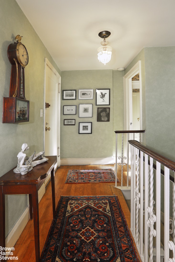 2 Beekman Place, Unit 15/16C Manhattan, NY 10022 - Photo 11 of 18 a bedroom with bed and wooden floor