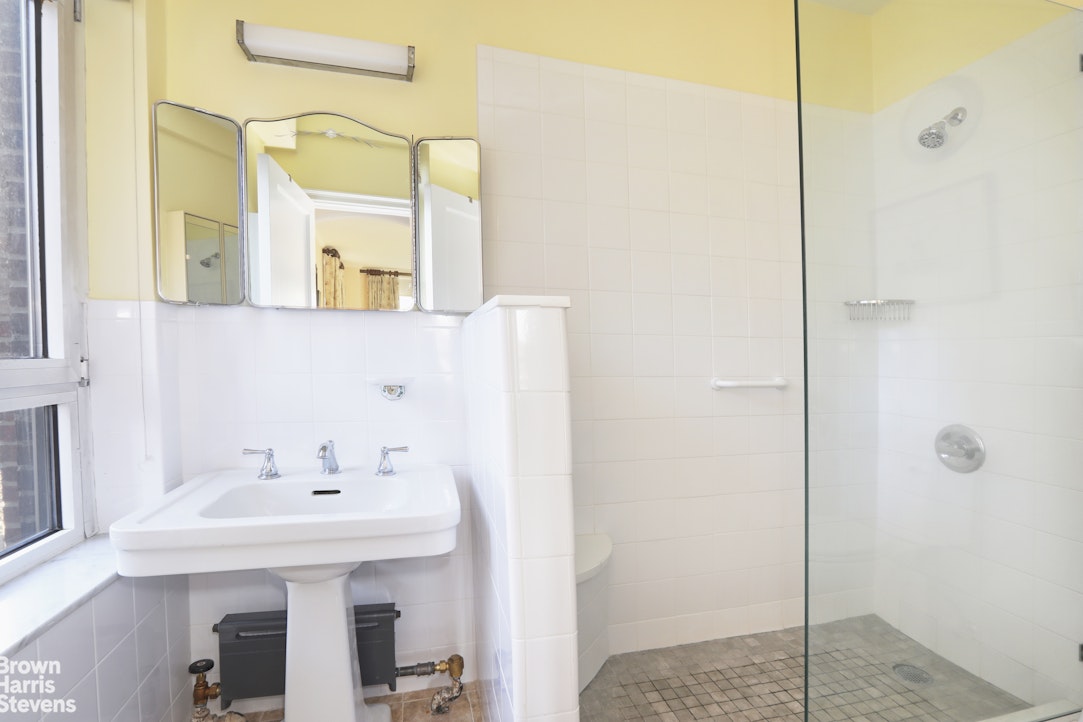 2 Beekman Place, Unit 15/16C Manhattan, NY 10022 - Photo 15 of 18 a bathroom with a sink and a mirror