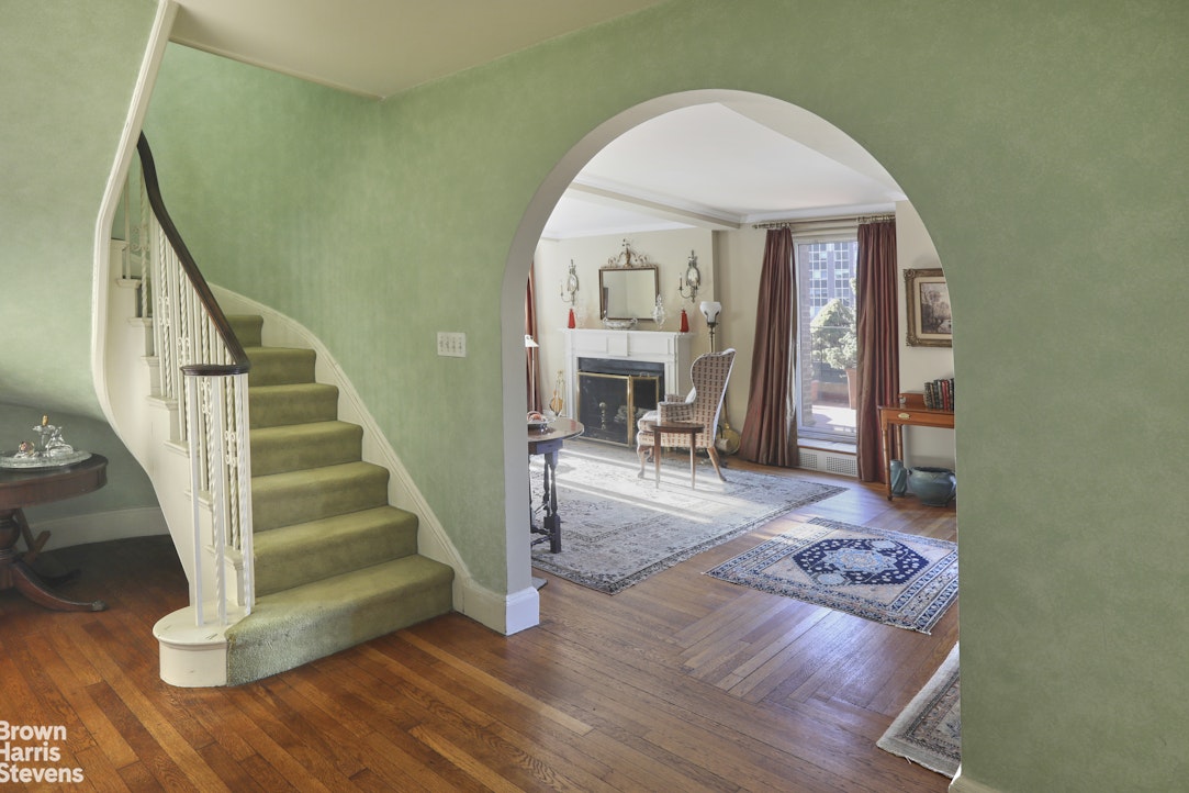 2 Beekman Place, Unit 15/16C Manhattan, NY 10022 - Photo 2 of 18 a view of a hallway view with wooden floor staircase and a living room