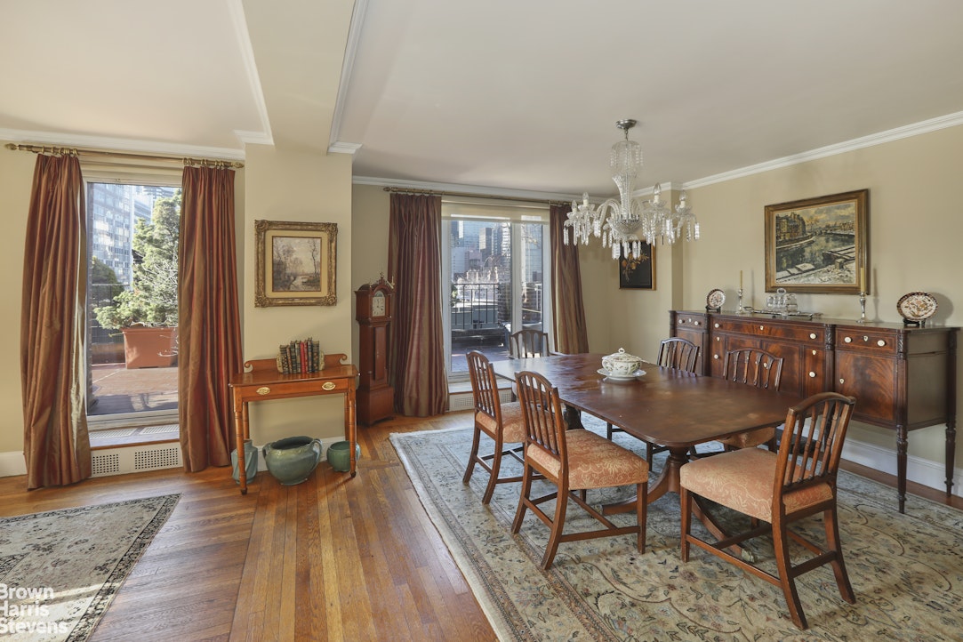 2 Beekman Place, Unit 15/16C Manhattan, NY 10022 - Photo 4 of 18 a view of a dining room with furniture window and wooden floor