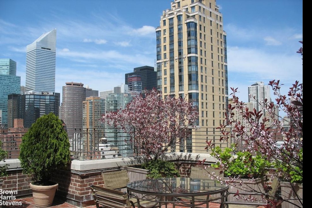 2 Beekman Place, Unit 15/16C Manhattan, NY 10022 - Photo 5 of 18 a view of a city with tall buildings