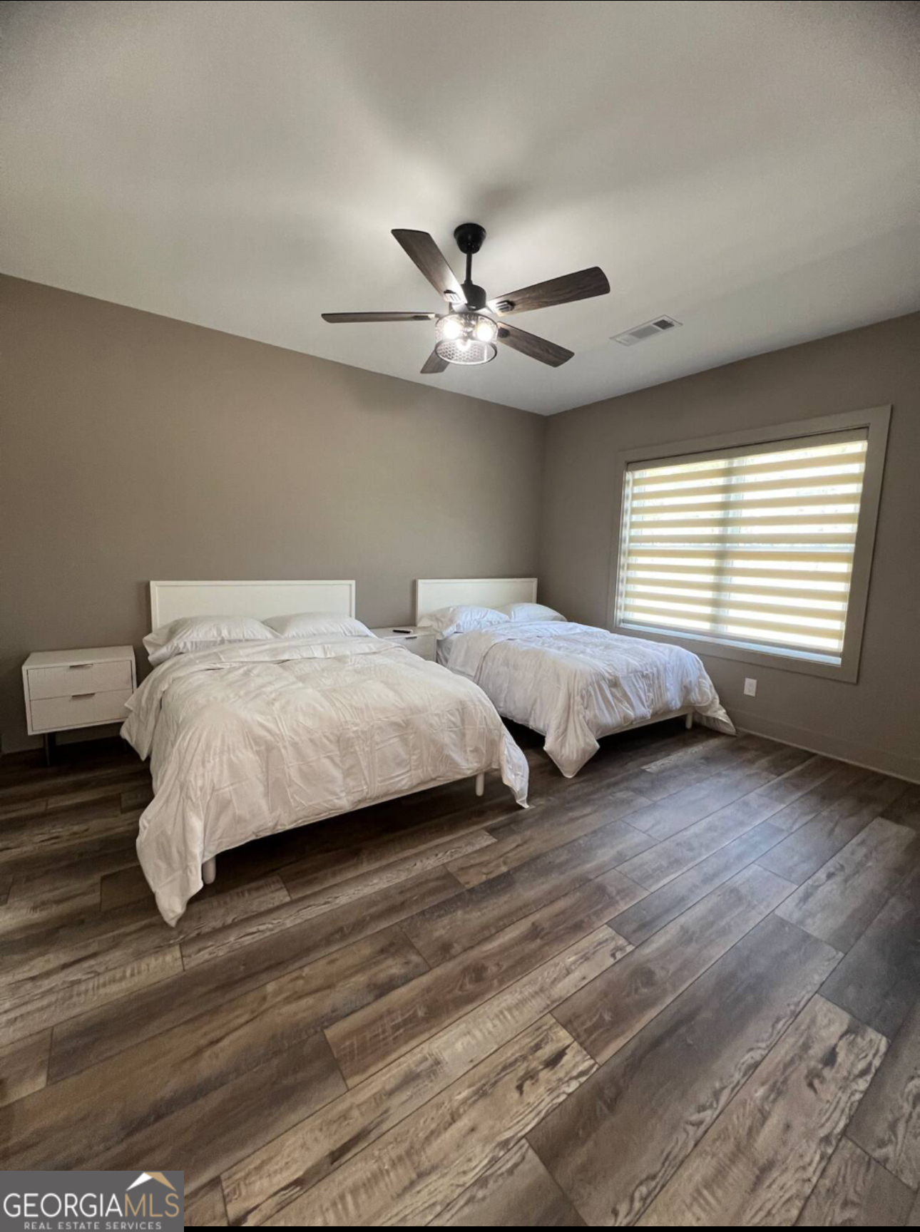 950 Island Shoals Road Jackson, GA 30233 - Photo 12 of 20 a bedroom with two beds and a ceiling fan
