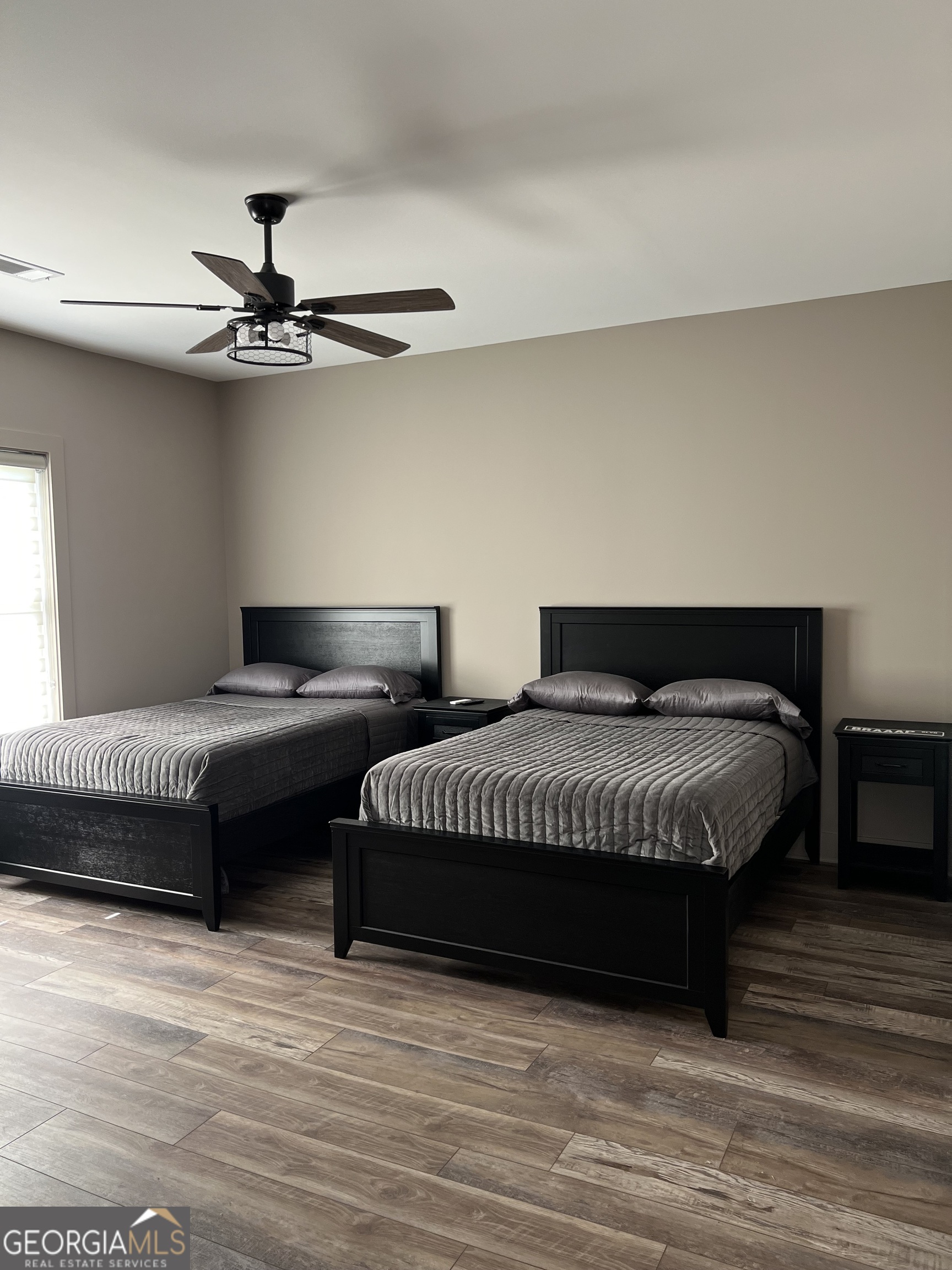 950 Island Shoals Road Jackson, GA 30233 - Photo 14 of 20 a spacious bedroom with a bed and a ceiling fan