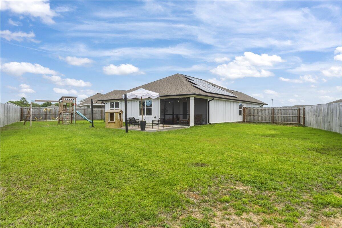 943 Sandbar Loop Crestview, FL 32539 - Photo 43 of 59 a view of a house with a backyard