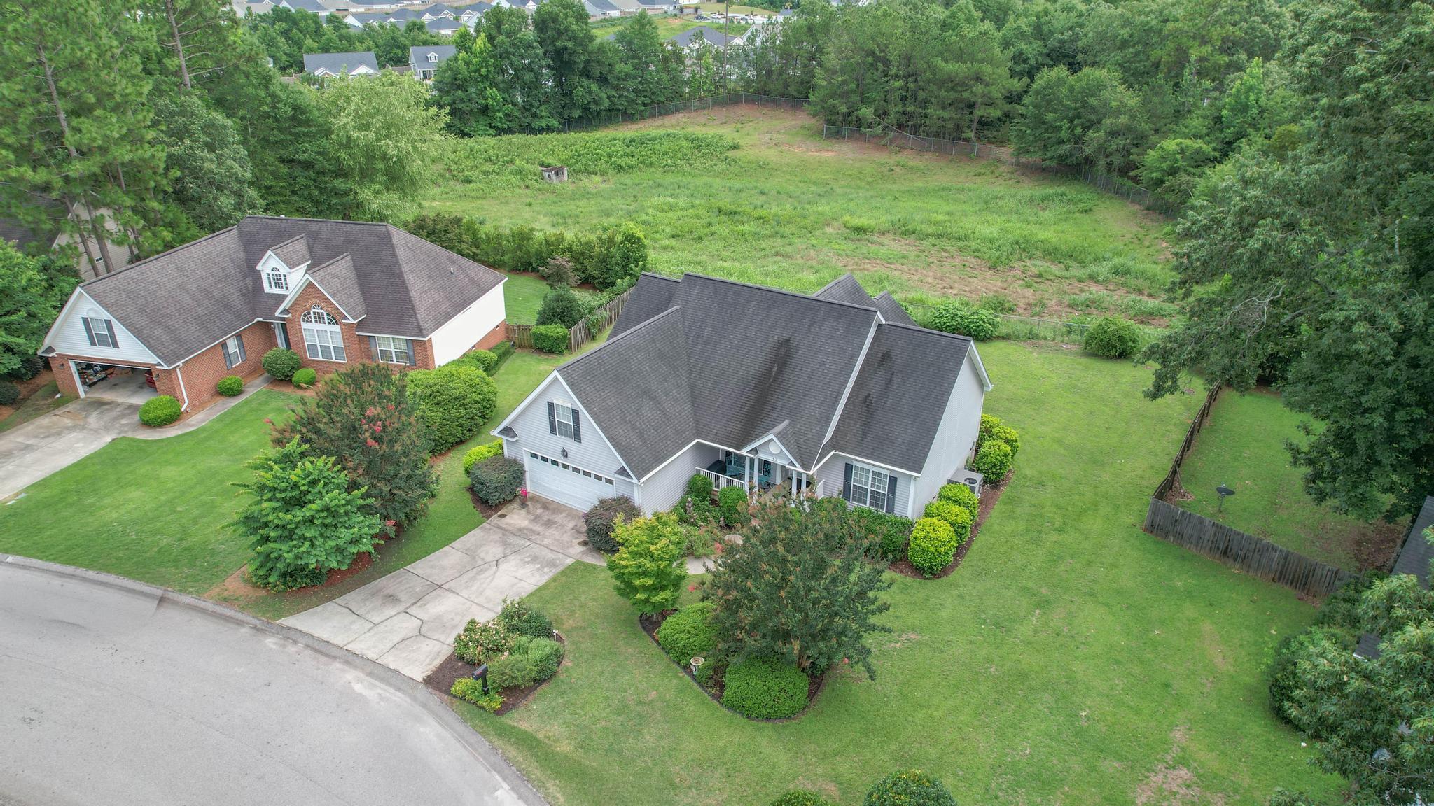 42 Emerald Ridge Aiken, SC 29803 - Photo 30 of 33 an aerial view of a house with garden space and street view