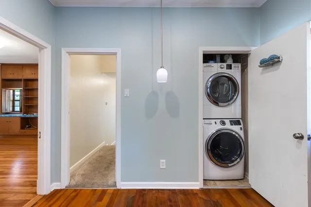 a view of a hallway with washer and dryer