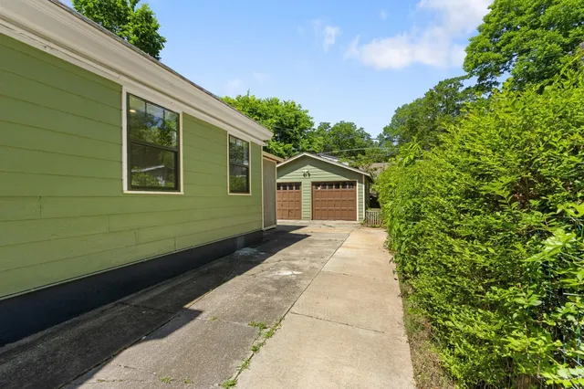a view of a wooden door and a yard