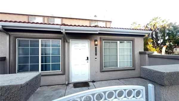 a front view of a house with large windows