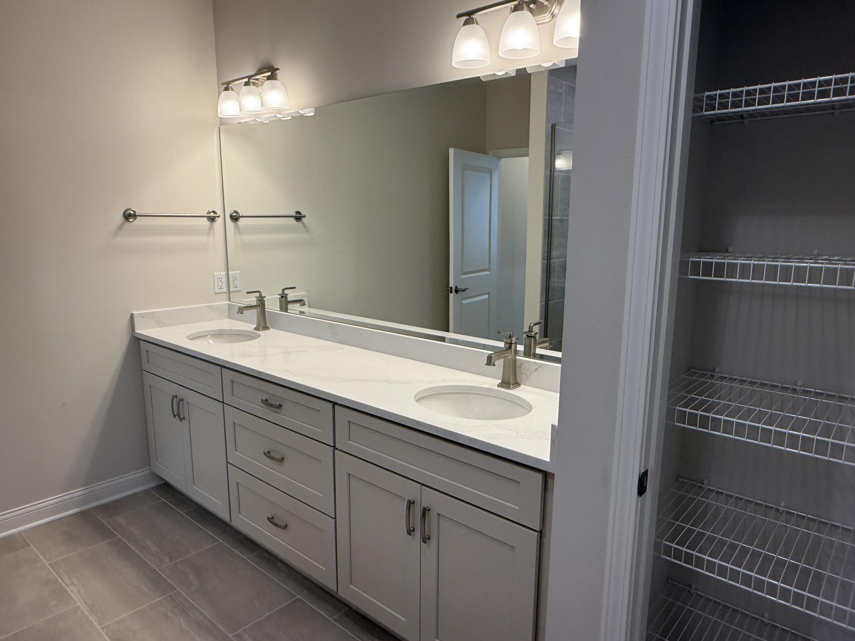 369 Evergreen Lane Pewaukee, WI 53072 - Photo 12 of 27 Primary en suite w/double sink vanity