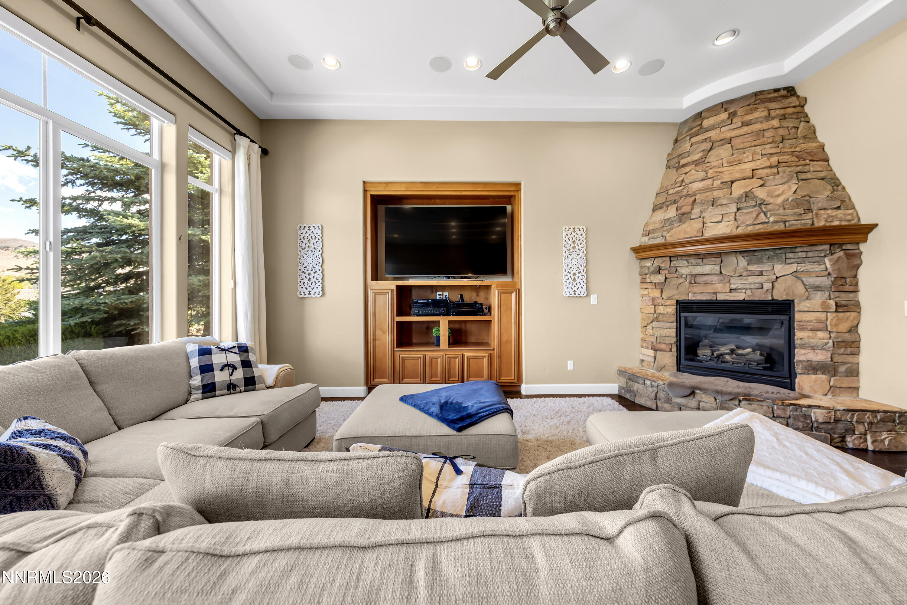 1898 Laurel Ridge Drive Reno, NV 89523 - Photo 33 of 87 a living room with furniture a flat screen tv and a fireplace