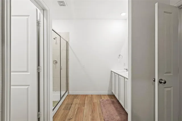 a bedroom with a bed and a table in it