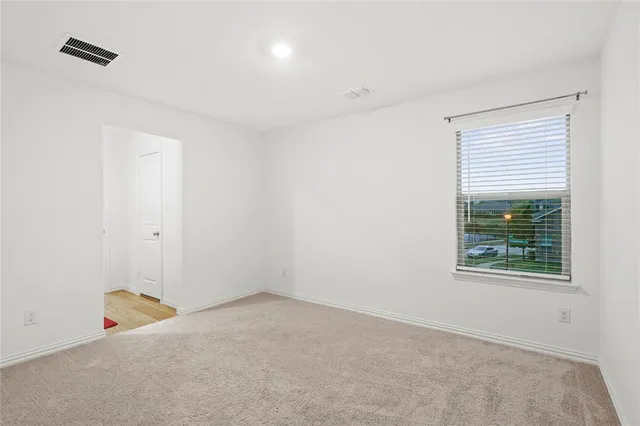 a bathroom with a bathtub and window