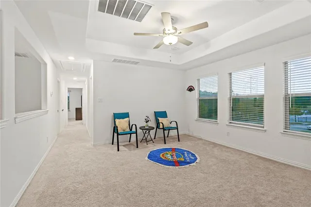 a view of a livingroom with furniture and windows