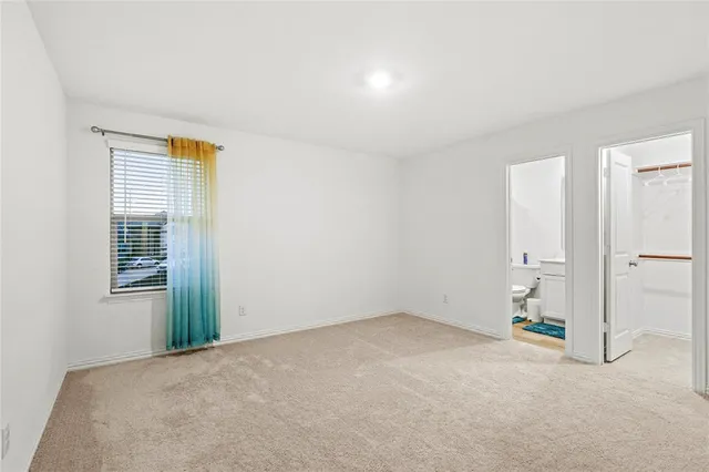 a view of a livingroom with furniture and window
