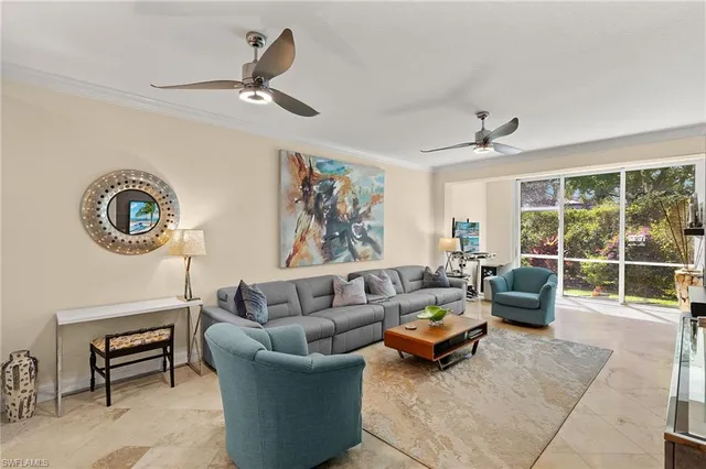 a kitchen with stainless steel appliances a stove a sink cabinets and a refrigerator