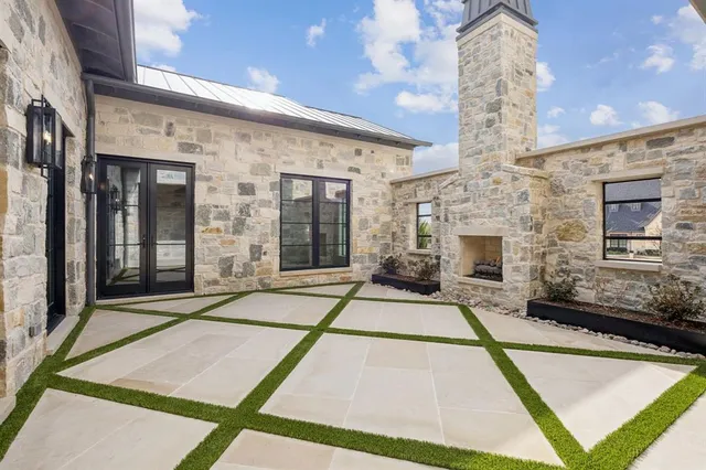 a swimming pool with outdoor seating and yard