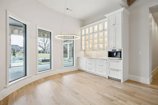 a room with window and cabinet