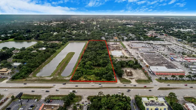 an aerial view of residential building and lake