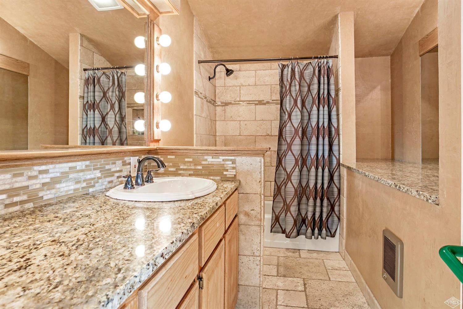 2613 Bear Trap Road Avon, CO 81620 - Photo 11 of 25 a bathroom with a sink and a mirror