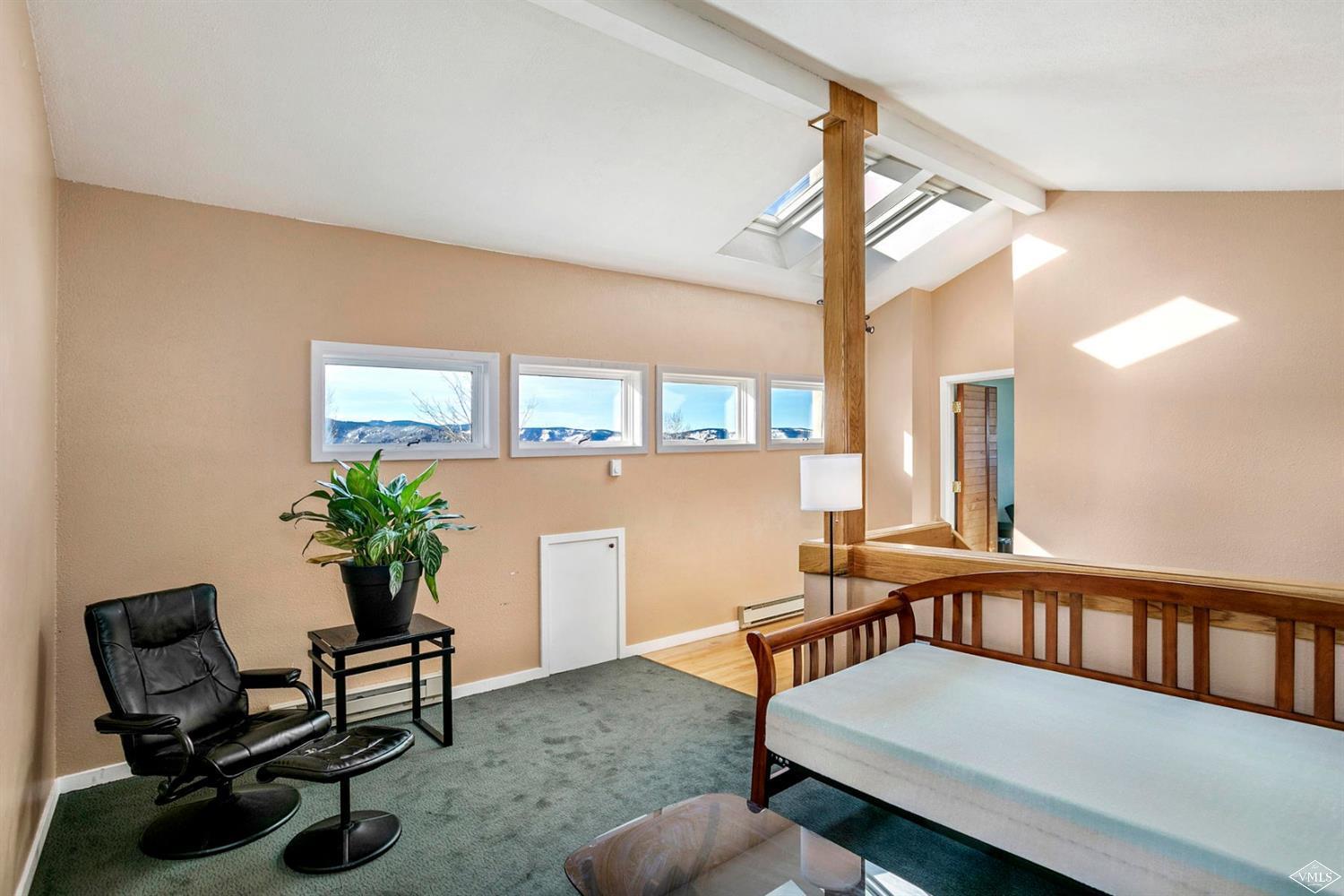 2613 Bear Trap Road Avon, CO 81620 - Photo 14 of 25 a reading room with furniture and a potted plant