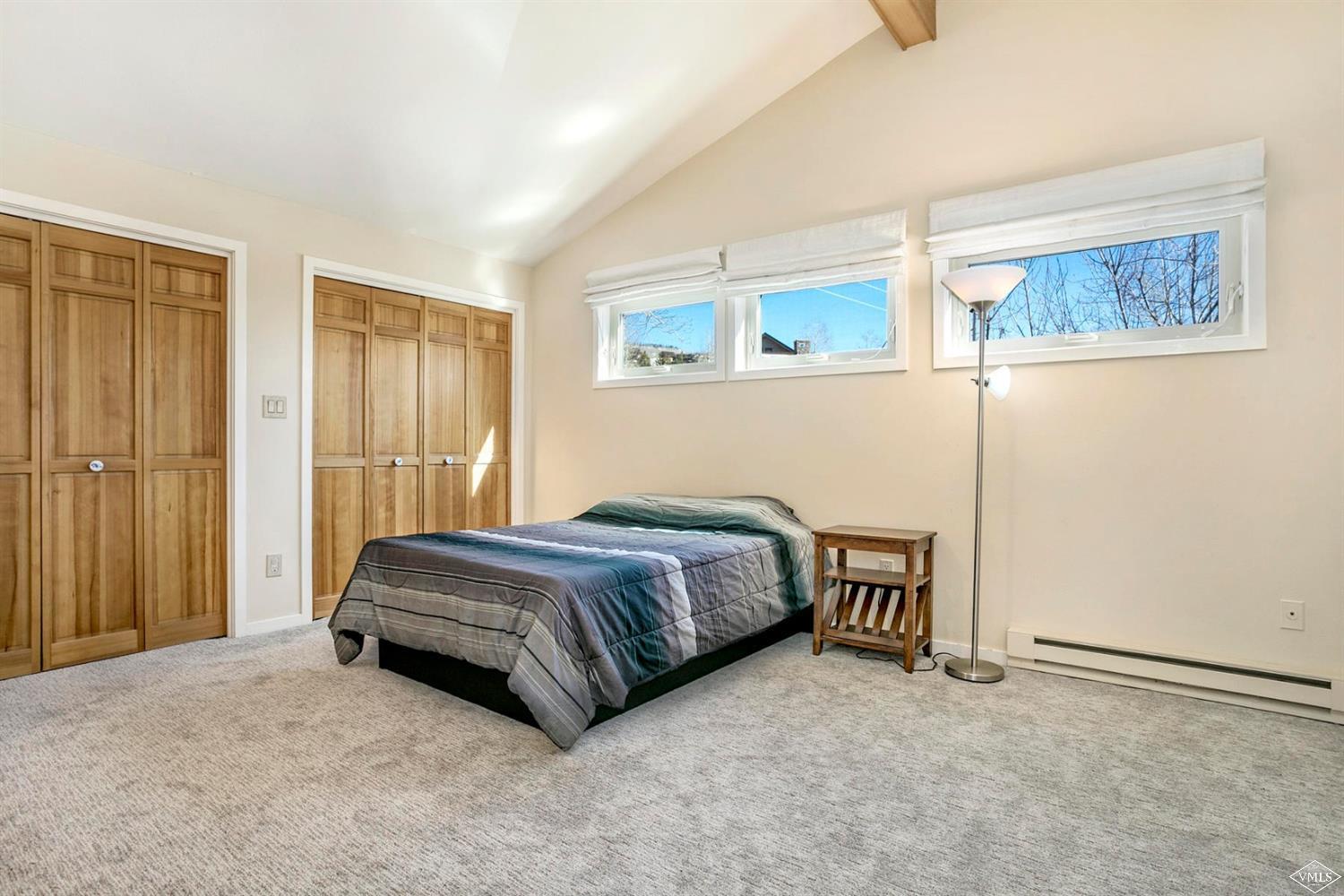 2613 Bear Trap Road Avon, CO 81620 - Photo 19 of 25 a spacious bedroom with a bed and a cabinets